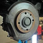 Brake cooling ducts and a deflector on a sports car in a paddock